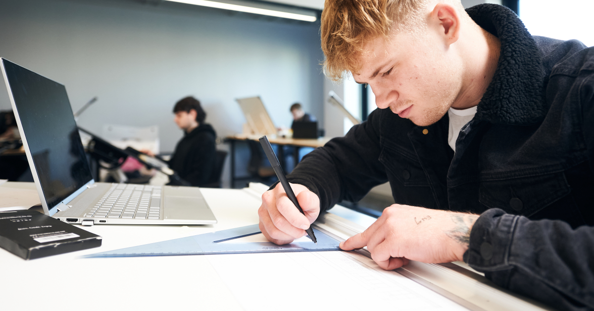 Architecture Student drawing with Laptop