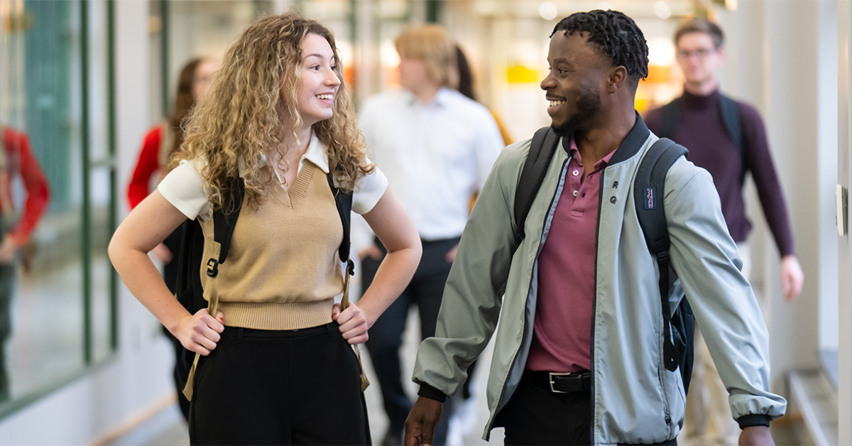 Two WMU Haworth students walking through Schneider Hall.