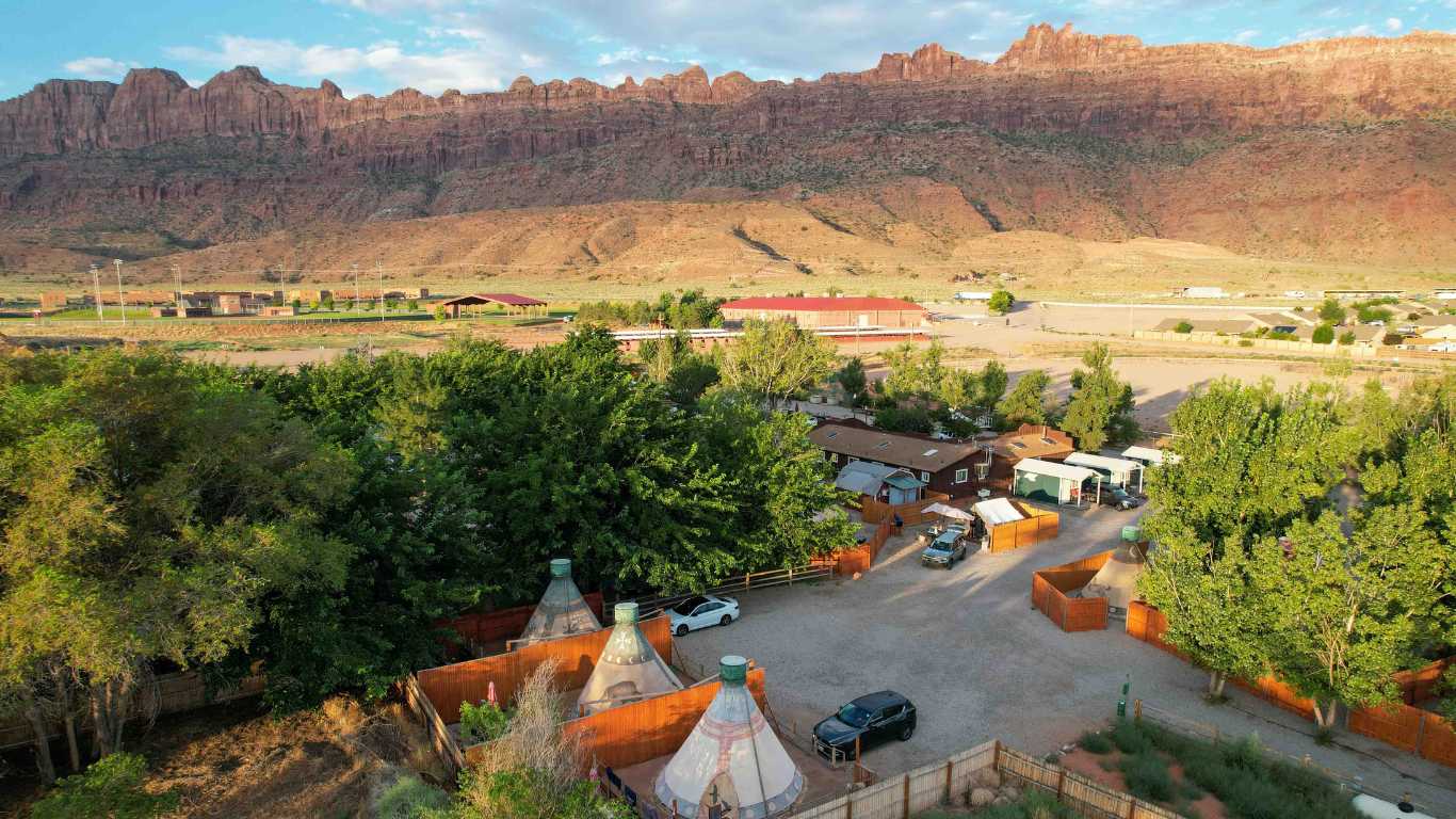 Moab RV & Glamping resort aerial view with tipis, rv sites, tents