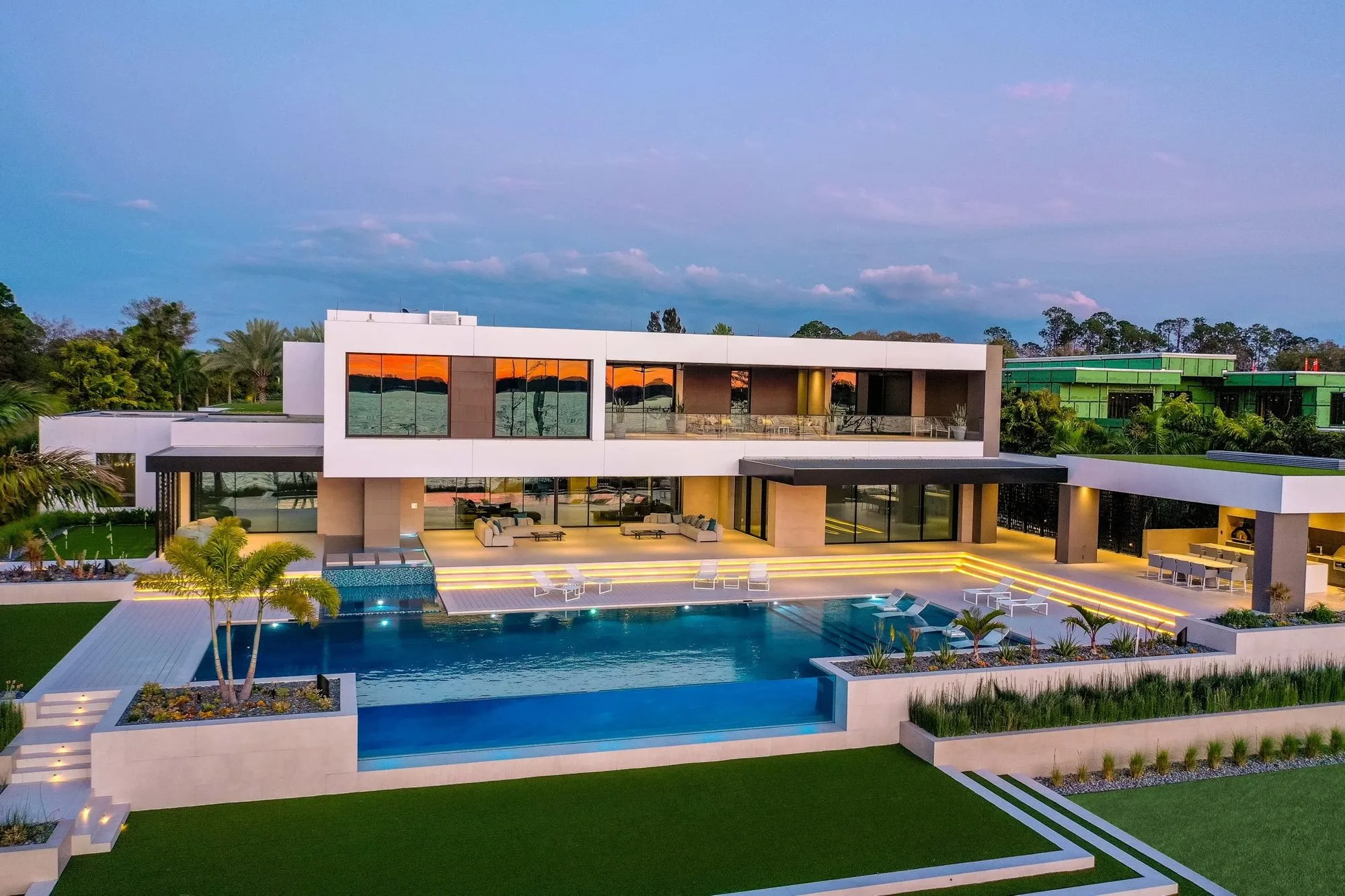 Luxury modern home photographed at twilight with architectural lighting by John Unrue Photography