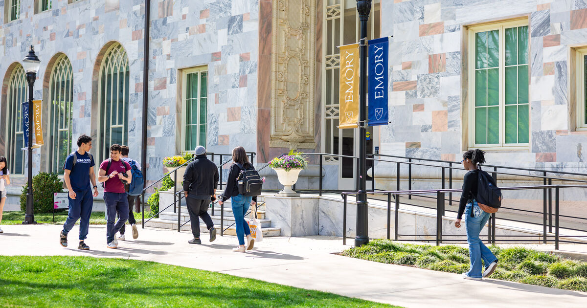 students walking on a pathway between the Quad and Convocation Hall