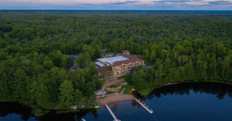 An aerial photo of Neale Lodge and Forest Springs, taken at dusk.