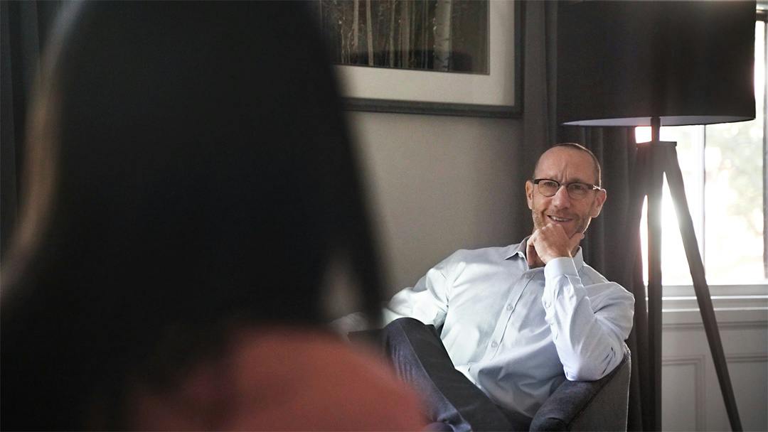 Brian Mahoney talking with client