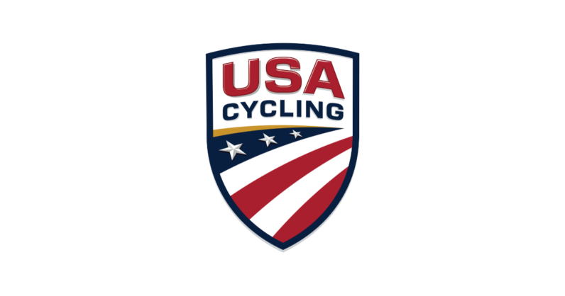 A shield with USA Cycling in bold at the top, and then a stylized American flag that represents all the roads, trails, and paths a bike can ride.